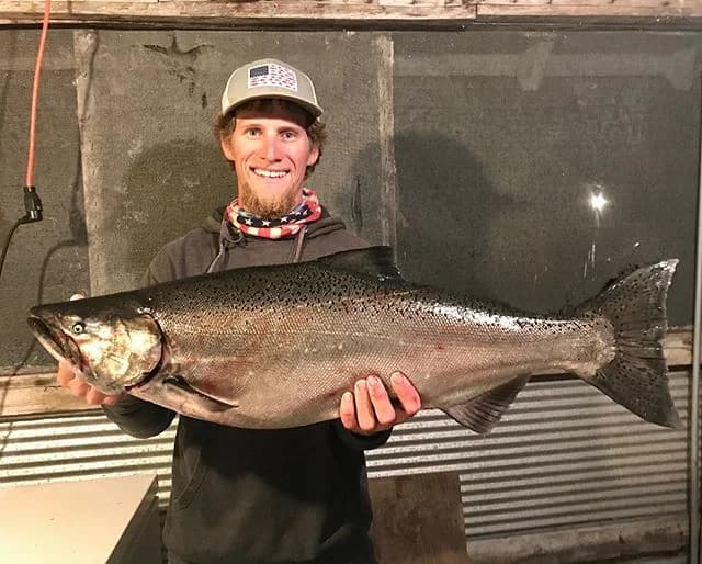 Angler with a catch on an Island Charters trip